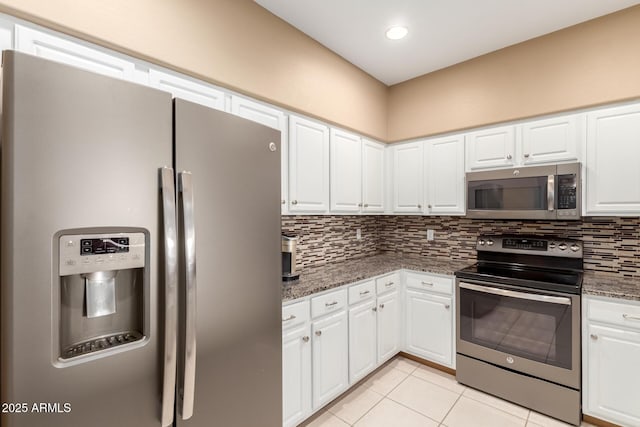 16626 E Westby Dr Unit 108, Fountain Hills, AZ 85268 - kitchen with stainless steel appliances, backsplash, light tile patterned flooring, white cabinetry, and recessed lighting