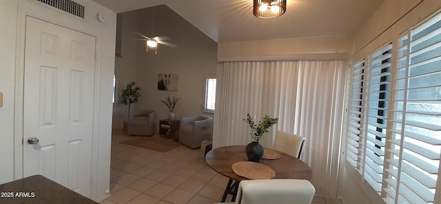 dining area featuring light tile patterned flooring and a ceiling fan