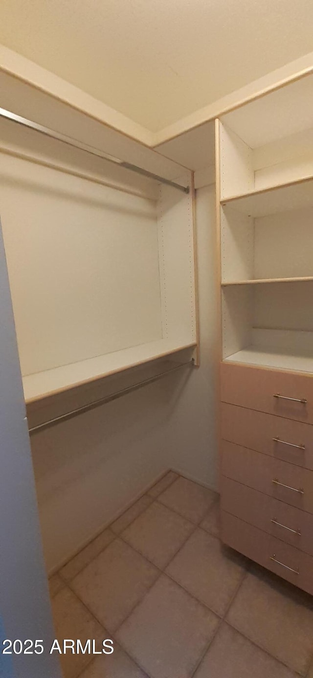 walk in closet featuring tile patterned floors
