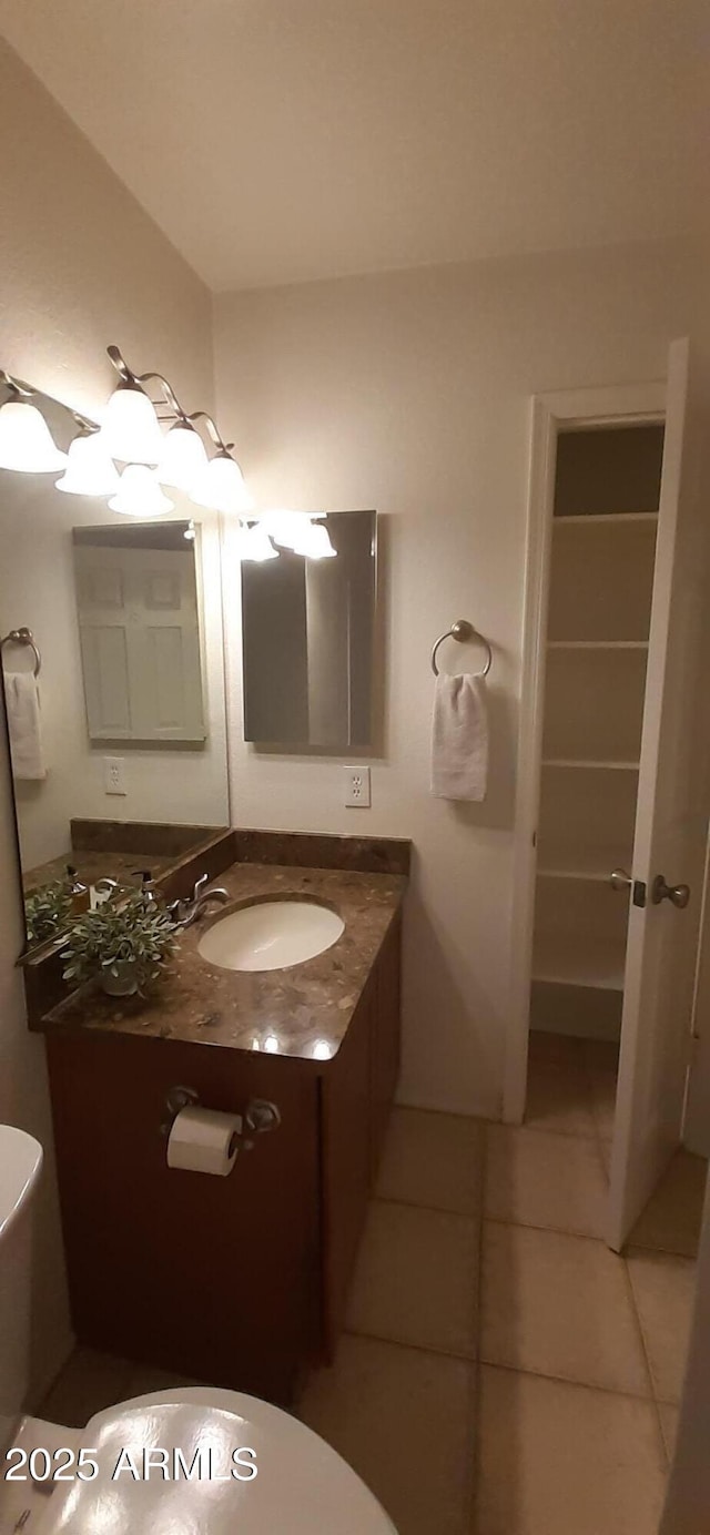 bathroom featuring tile patterned floors and vanity