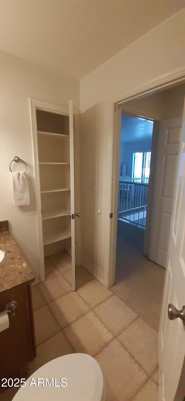 bathroom with tile patterned flooring and vanity