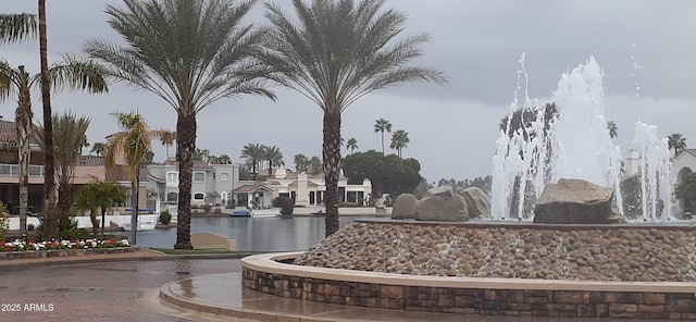 view of community with a residential view and a water view