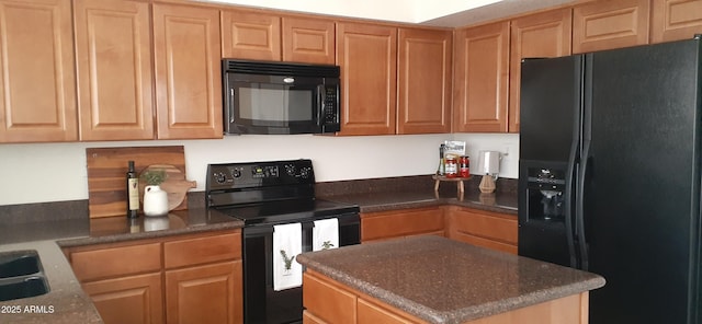 kitchen with black appliances, a center island, a sink, and dark stone counters