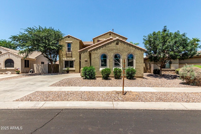 4322 S Ranger Trl, Gilbert, AZ 85297 - mediterranean / spanish home with stucco siding, driveway, and a tile roof