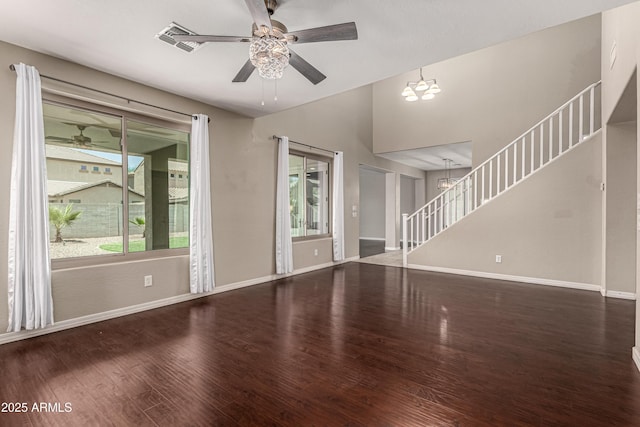 4322 S Ranger Trl, Gilbert, AZ 85297 - unfurnished living room with stairs, wood finished floors, a ceiling fan, and a chandelier