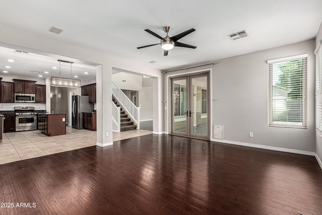 4322 S Ranger Trl, Gilbert, AZ 85297 - unfurnished living room with a ceiling fan, light wood finished floors, stairs, recessed lighting, and french doors