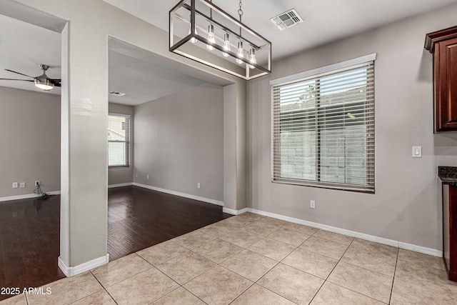 4322 S Ranger Trl, Gilbert, AZ 85297 - unfurnished dining area with plenty of natural light, light wood-style flooring, and ceiling fan