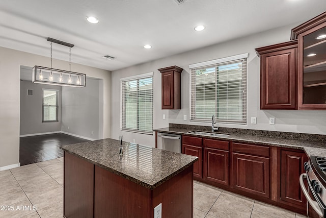 4322 S Ranger Trl, Gilbert, AZ 85297 - kitchen featuring stainless steel appliances, light tile patterned floors, a kitchen island, pendant lighting, and recessed lighting