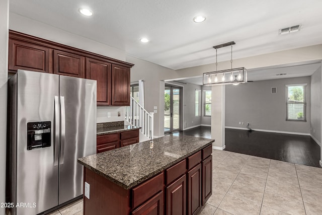 4322 S Ranger Trl, Gilbert, AZ 85297 - kitchen featuring stainless steel fridge, light tile patterned floors, a center island, recessed lighting, and pendant lighting