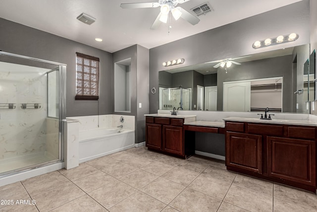 4322 S Ranger Trl, Gilbert, AZ 85297 - bathroom featuring ceiling fan, double vanity, a garden tub, and a stall shower