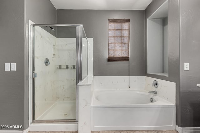4322 S Ranger Trl, Gilbert, AZ 85297 - bathroom featuring a garden tub, a shower stall, and a textured wall