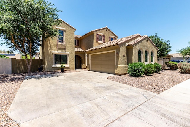 4322 S Ranger Trl, Gilbert, AZ 85297 - mediterranean / spanish home with a tile roof, stucco siding, a garage, and concrete driveway