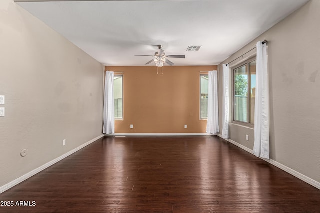 4322 S Ranger Trl, Gilbert, AZ 85297 - empty room featuring dark wood finished floors and a ceiling fan