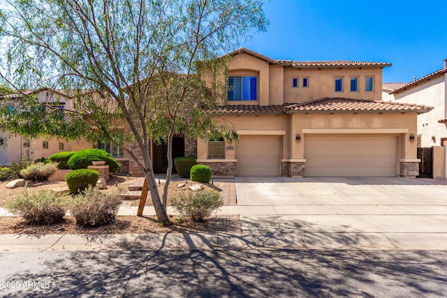 31604 N 19th Ave, Phoenix, AZ 85085 - mediterranean / spanish home featuring a tiled roof, an attached garage, stone siding, stucco siding, and driveway