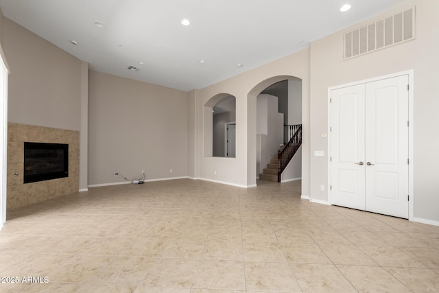 31604 N 19th Ave, Phoenix, AZ 85085 - unfurnished living room featuring light tile patterned floors, stairs, visible vents, and recessed lighting