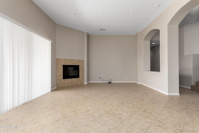 31604 N 19th Ave, Phoenix, AZ 85085 - unfurnished living room with baseboards, light tile patterned floors, a tiled fireplace, and visible vents