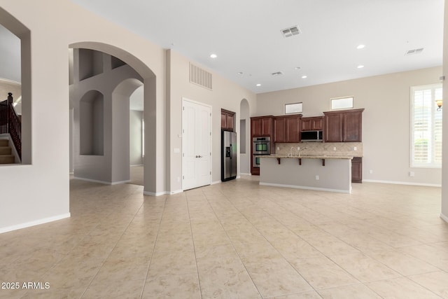 31604 N 19th Ave, Phoenix, AZ 85085 - unfurnished living room featuring light tile patterned floors, visible vents, and recessed lighting