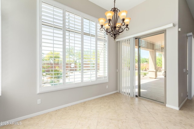 31604 N 19th Ave, Phoenix, AZ 85085 - tiled empty room featuring baseboards and an inviting chandelier