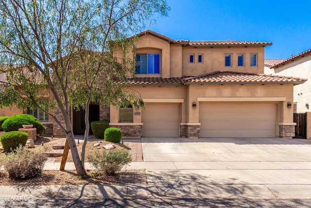 31604 N 19th Ave, Phoenix, AZ 85085 - mediterranean / spanish-style home featuring an attached garage, stone siding, a tile roof, stucco siding, and driveway