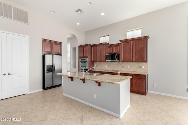 31604 N 19th Ave, Phoenix, AZ 85085 - kitchen with arched walkways, a sink, visible vents, and stainless steel appliances