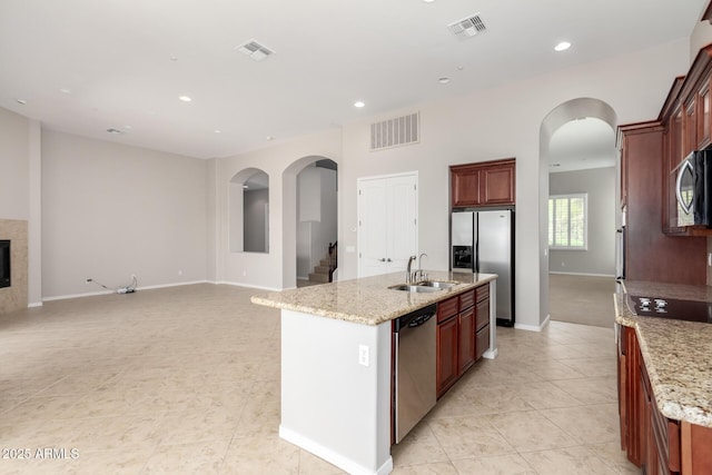 31604 N 19th Ave, Phoenix, AZ 85085 - kitchen featuring light tile patterned floors, arched walkways, visible vents, a sink, and stainless steel appliances