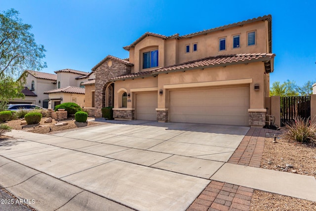 31604 N 19th Ave, Phoenix, AZ 85085 - mediterranean / spanish house featuring stucco siding, driveway, stone siding, an attached garage, and a tile roof