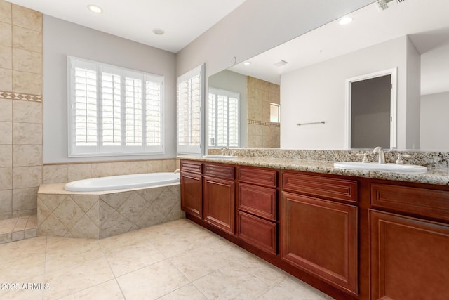 31604 N 19th Ave, Phoenix, AZ 85085 - bathroom featuring tile patterned floors, a garden tub, double vanity, and a sink