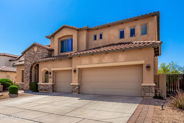 31604 N 19th Ave, Phoenix, AZ 85085 - mediterranean / spanish house featuring concrete driveway, stucco siding, stone siding, a tile roof, and a garage