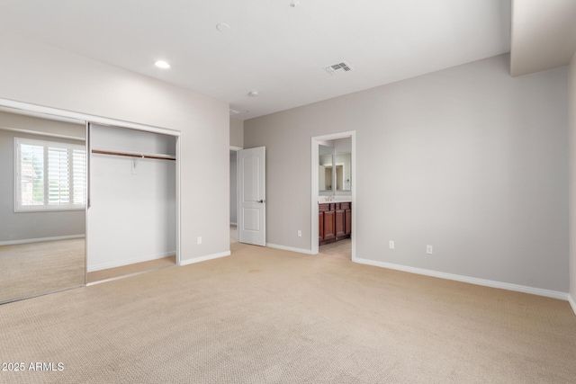 31604 N 19th Ave, Phoenix, AZ 85085 - unfurnished bedroom featuring light carpet, a closet, baseboards, and visible vents