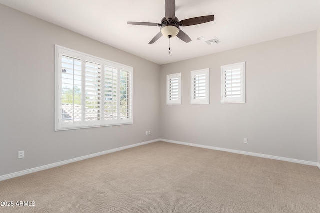 31604 N 19th Ave, Phoenix, AZ 85085 - empty room featuring light colored carpet, baseboards, a ceiling fan, and visible vents