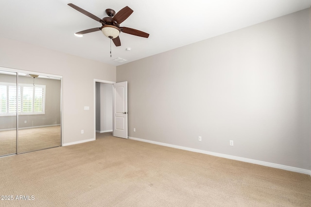 31604 N 19th Ave, Phoenix, AZ 85085 - unfurnished bedroom with a closet, baseboards, ceiling fan, and light colored carpet