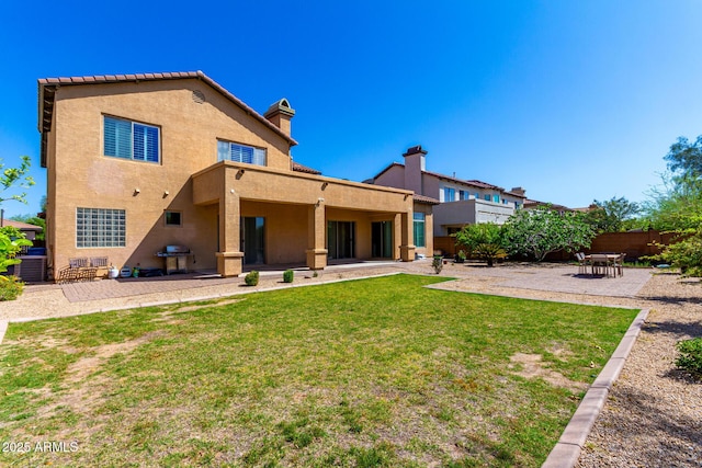 31604 N 19th Ave, Phoenix, AZ 85085 - rear view of house with a patio area, a lawn, fence, central air condition unit, and stucco siding
