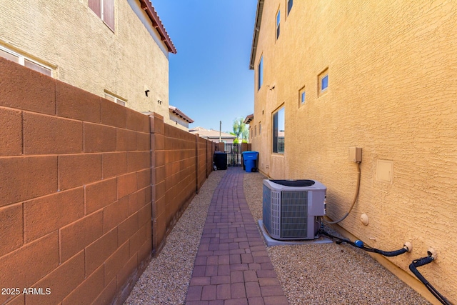 31604 N 19th Ave, Phoenix, AZ 85085 - view of property exterior featuring a fenced backyard, stucco siding, and central air condition unit
