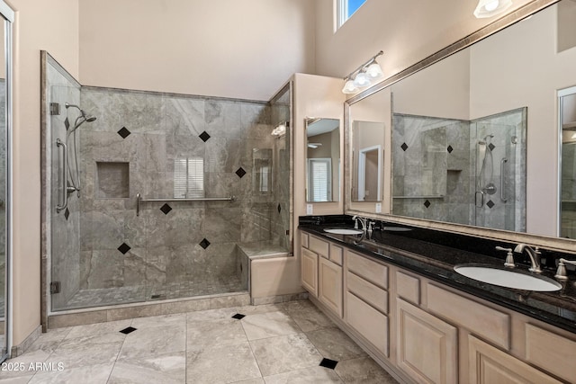 bathroom with walk in shower and vanity