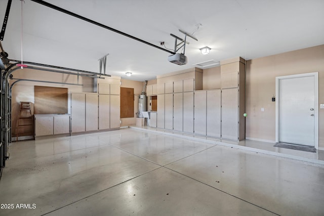 garage with water heater and a garage door opener