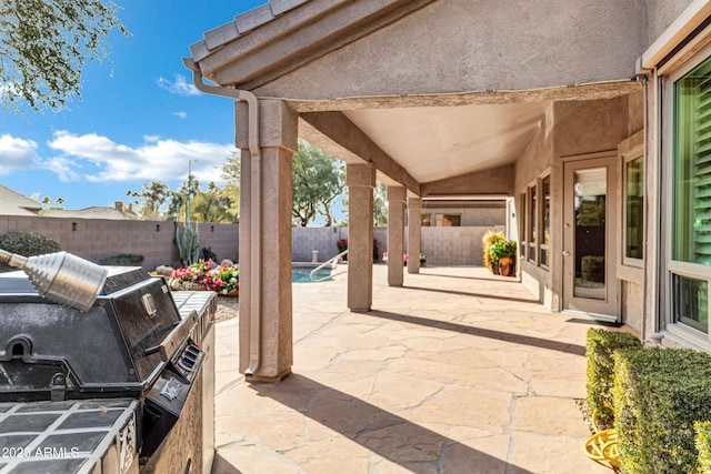 view of patio featuring a fenced in pool