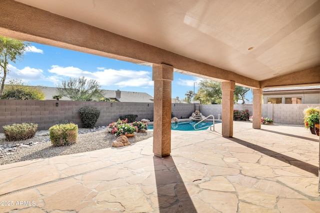 view of patio with a fenced in pool