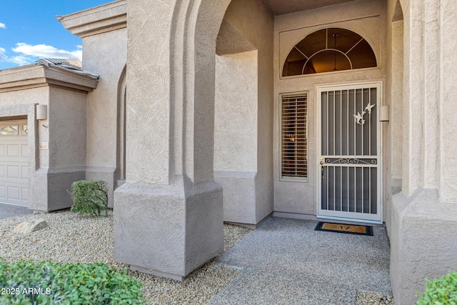 property entrance featuring a garage