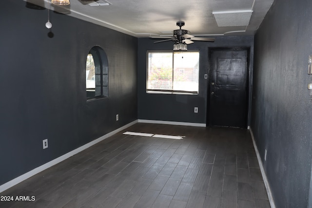 empty room featuring dark hardwood / wood-style floors and ceiling fan