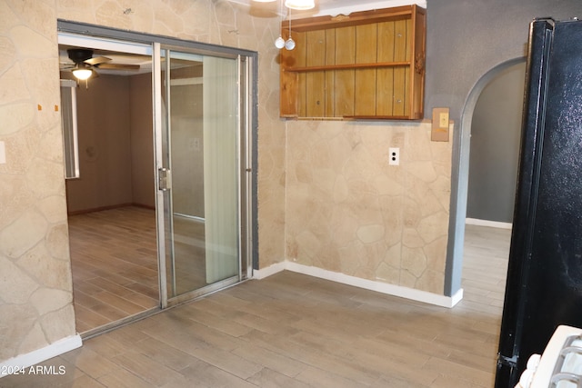 bathroom featuring ceiling fan and wood-type flooring