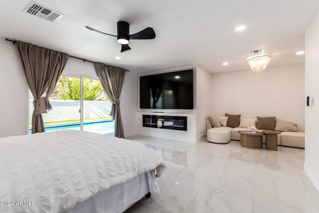 tiled bedroom featuring ceiling fan and access to exterior