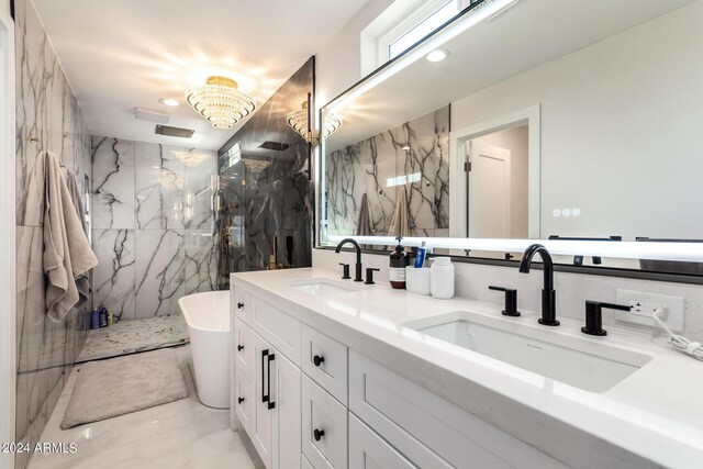 bathroom with an enclosed shower, double sink vanity, and tile patterned flooring