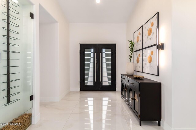 foyer entrance with light tile patterned floors