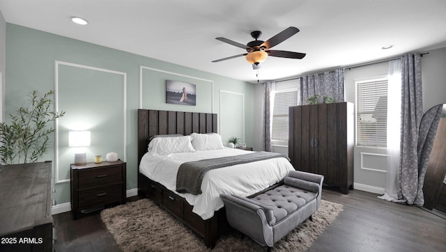 bedroom featuring ceiling fan and dark hardwood / wood-style flooring