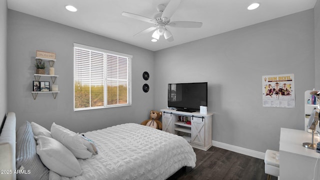 bedroom with ceiling fan and dark hardwood / wood-style floors