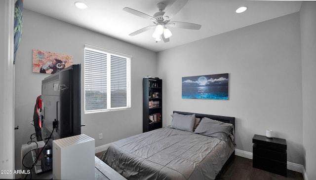 bedroom with ceiling fan and dark hardwood / wood-style flooring