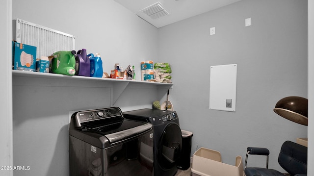 clothes washing area featuring washer and clothes dryer