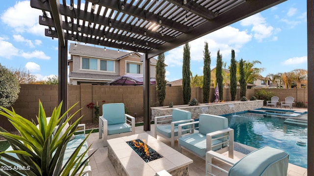 view of swimming pool featuring a pergola, a patio, and an outdoor fire pit