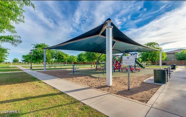 view of property's community featuring a playground and a yard