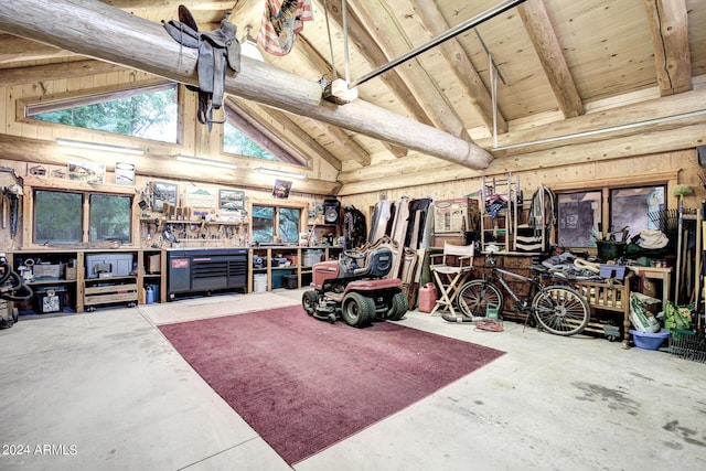 garage with a workshop area and wood ceiling